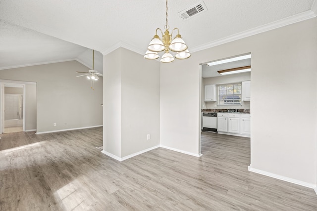 interior space featuring light hardwood / wood-style flooring, ornamental molding, and a textured ceiling