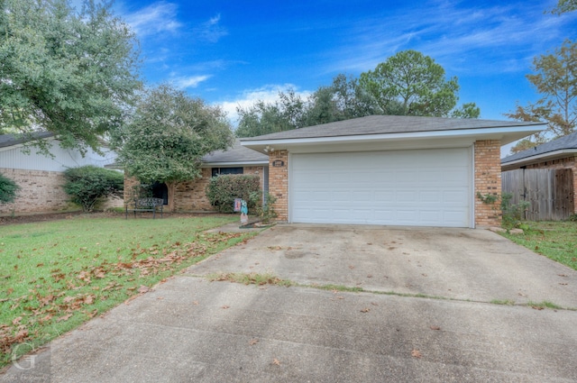 single story home with a front lawn and a garage