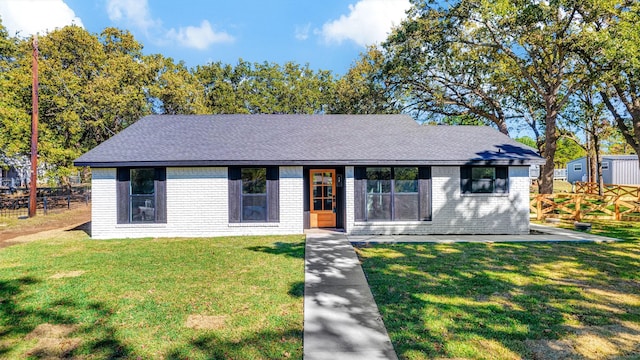56 Crappie Cres, Pottsboro, TX 75076 - view of front of home with brick siding, a front lawn, and roof with shingles