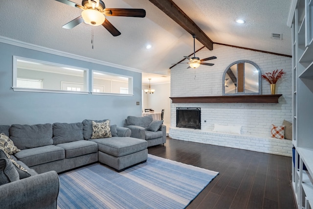 living room with lofted ceiling with beams, dark hardwood / wood-style flooring, ceiling fan, and crown molding