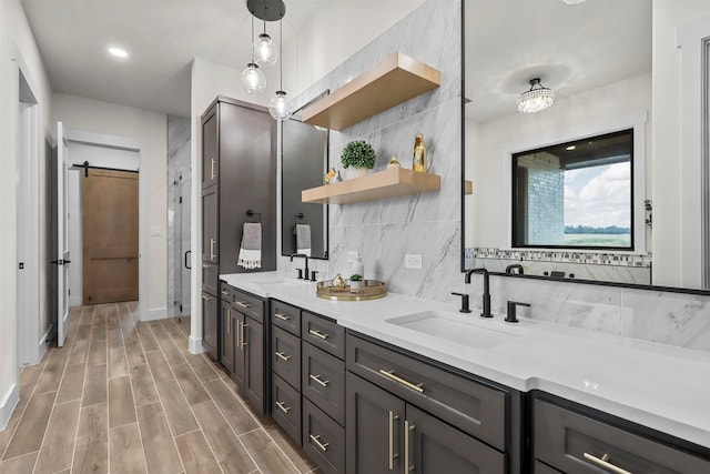 bathroom with wood-type flooring, vanity, and tasteful backsplash