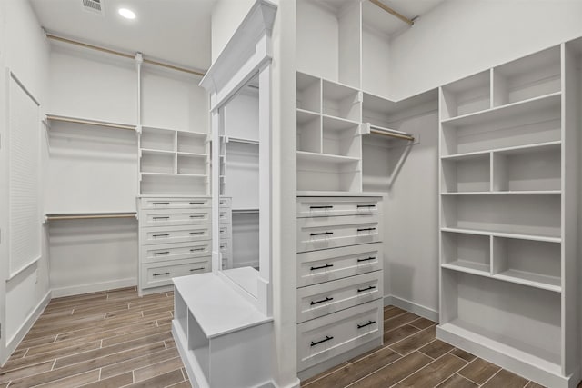 walk in closet featuring dark hardwood / wood-style flooring