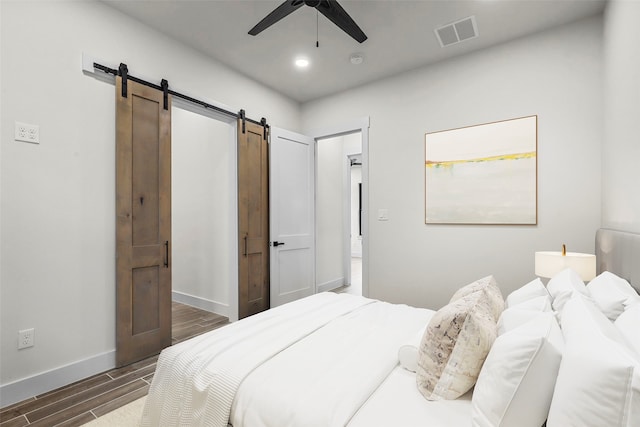 bedroom featuring ceiling fan and dark hardwood / wood-style floors