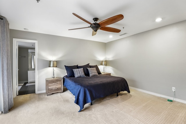 bedroom featuring light colored carpet and ceiling fan