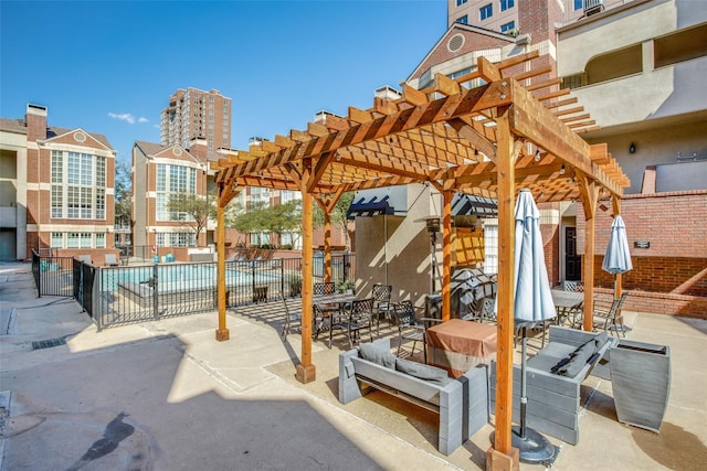 view of patio featuring a pergola and a community pool