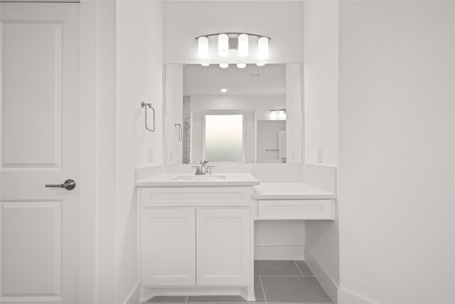 bathroom featuring tile patterned floors and vanity