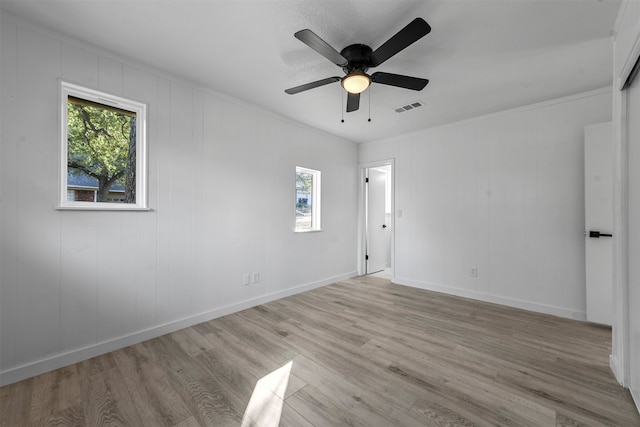 unfurnished room with ceiling fan and light hardwood / wood-style flooring