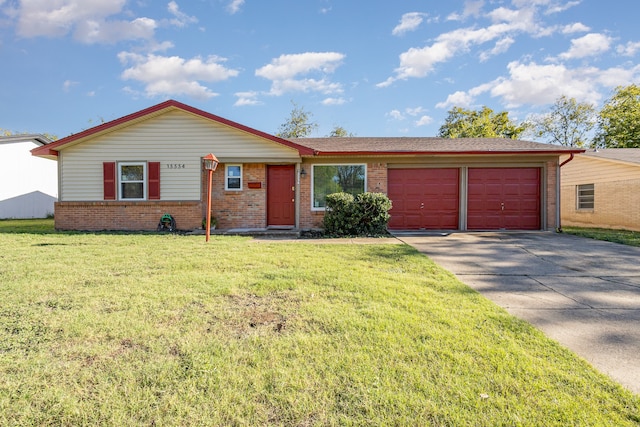 ranch-style home featuring a garage and a front yard