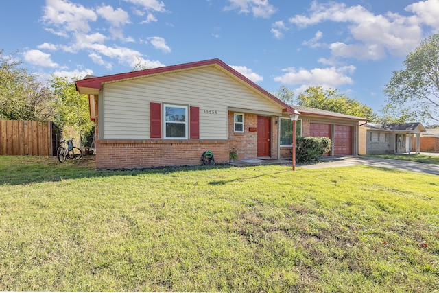 view of front of home featuring a garage and a front lawn