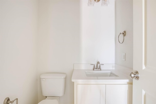 bathroom with toilet and vanity