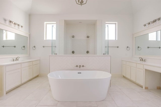 bathroom featuring a healthy amount of sunlight and tile patterned floors