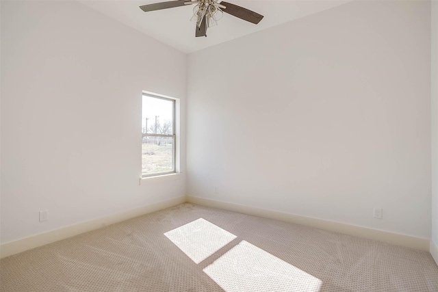 unfurnished room featuring light colored carpet and ceiling fan