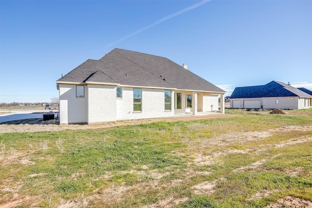 back of property featuring cooling unit and a patio