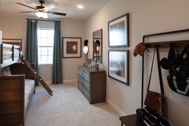 bedroom with light colored carpet and ceiling fan