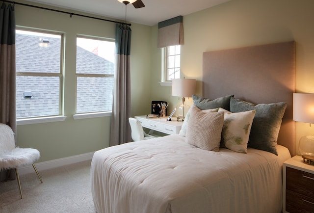 carpeted bedroom with ceiling fan