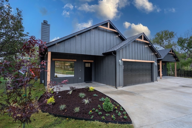 modern farmhouse style home featuring a garage