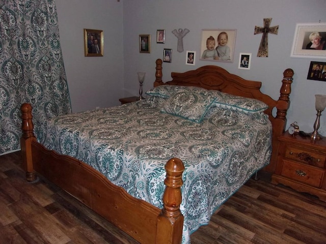 bedroom featuring dark wood-type flooring