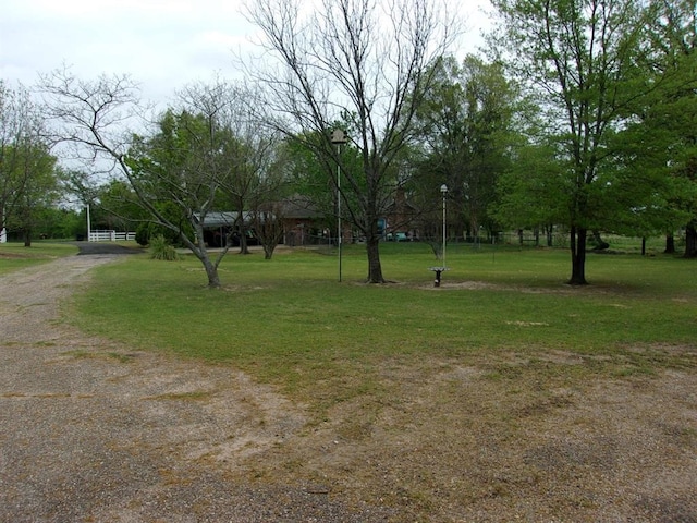 view of home's community with a lawn