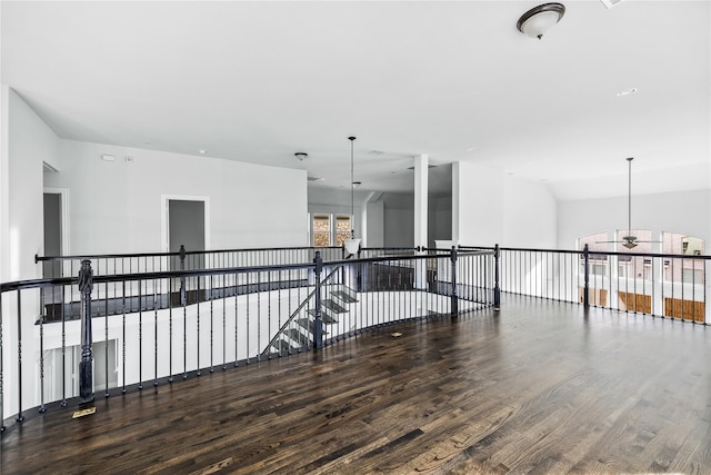 spare room with lofted ceiling and hardwood / wood-style floors