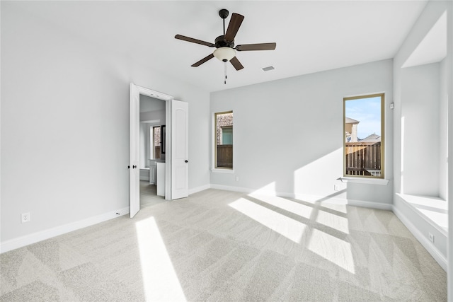 carpeted empty room featuring ceiling fan