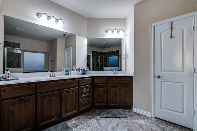 bathroom featuring vanity and a shower with shower door