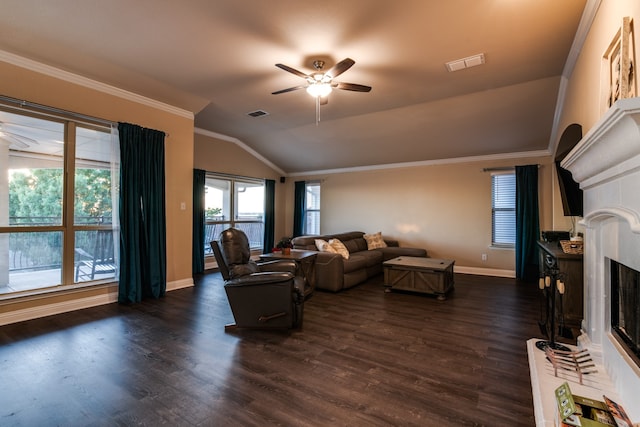 living room with dark hardwood / wood-style flooring, vaulted ceiling, ceiling fan, and crown molding