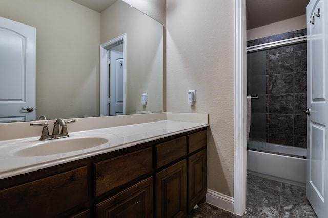 bathroom featuring vanity and enclosed tub / shower combo