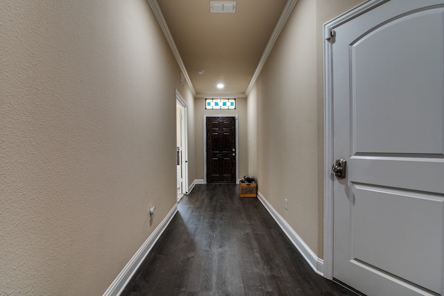 interior space with dark hardwood / wood-style floors and crown molding