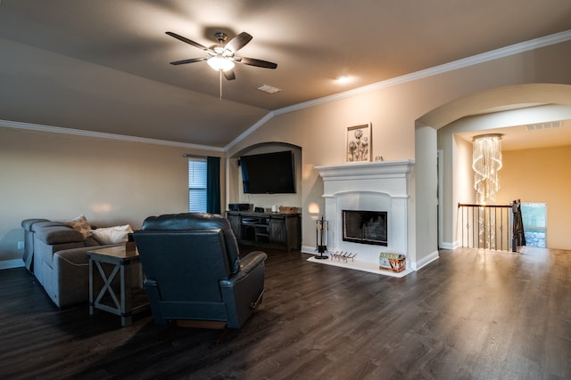 living room with ornamental molding, dark hardwood / wood-style flooring, lofted ceiling, and ceiling fan