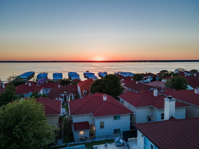 aerial view at dusk with a water view