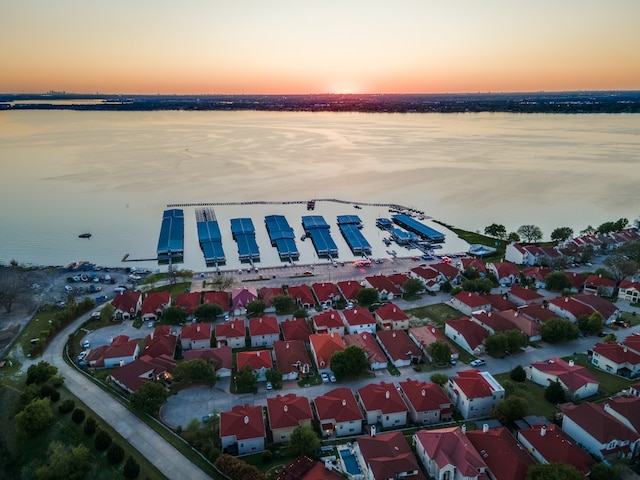 aerial view at dusk with a water view