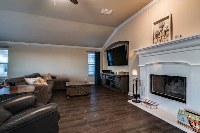 living room with ornamental molding, dark hardwood / wood-style flooring, lofted ceiling, and ceiling fan