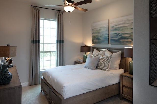 bedroom with light carpet and ceiling fan