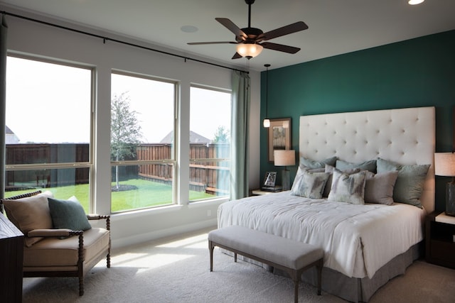 carpeted bedroom featuring ceiling fan