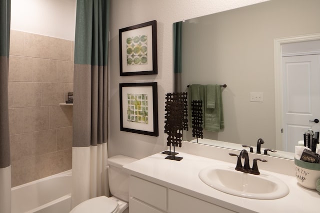 full bathroom with vanity, toilet, and shower / tub combo with curtain