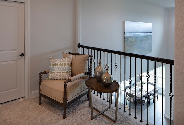 sitting room featuring carpet flooring