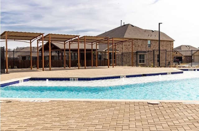 view of pool with pool water feature