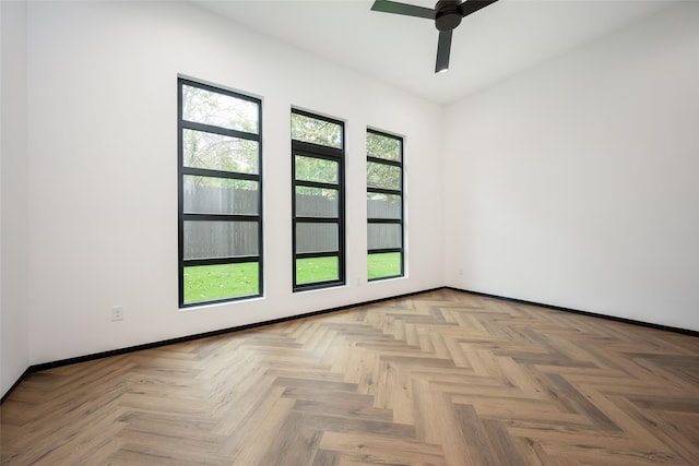 unfurnished room featuring light parquet floors and ceiling fan