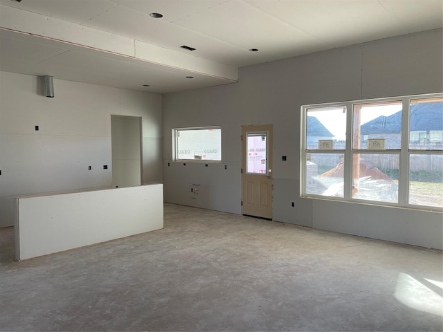 unfurnished living room featuring a mountain view