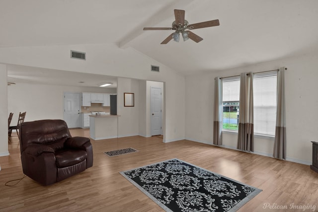 living room featuring high vaulted ceiling, light hardwood / wood-style floors, ceiling fan, and beam ceiling