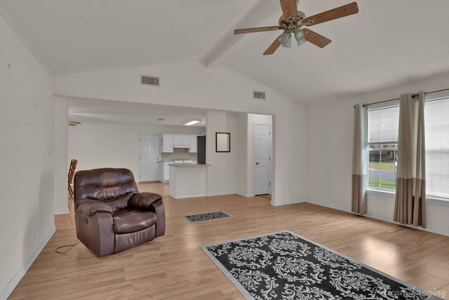 interior space with light wood-type flooring, lofted ceiling with beams, and ceiling fan