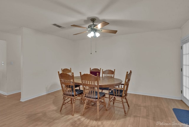 101 W Jefferson Ave, Haughton, LA 71037 - dining room with light wood-style flooring, a ceiling fan, and baseboards