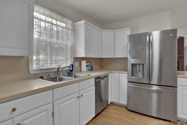 101 W Jefferson Ave, Haughton, LA 71037 - kitchen with stainless steel appliances, a sink, white cabinetry, and light countertops