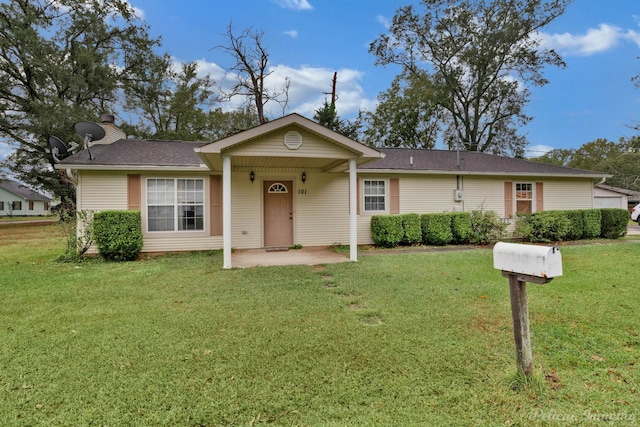 single story home with a front lawn