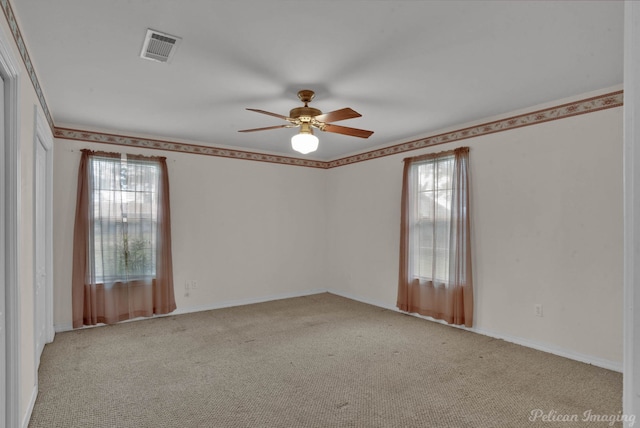 101 W Jefferson Ave, Haughton, LA 71037 - unfurnished room featuring healthy amount of natural light, a ceiling fan, carpet, and baseboards