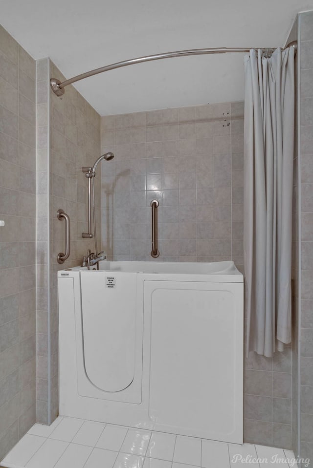 101 W Jefferson Ave, Haughton, LA 71037 - bathroom with tile walls, a tile shower, a tub, and tile patterned floors