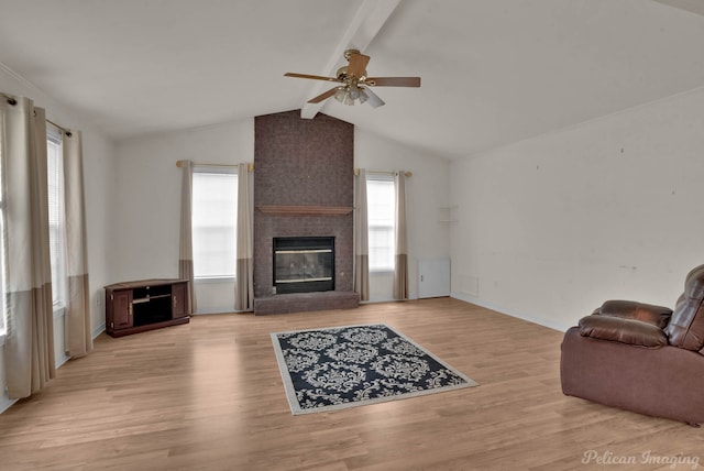 101 W Jefferson Ave, Haughton, LA 71037 - living area with ceiling fan, a fireplace, wood finished floors, and baseboards