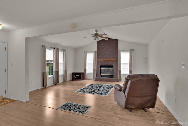 101 W Jefferson Ave, Haughton, LA 71037 - living area with light wood-type flooring, ceiling fan, a fireplace, vaulted ceiling, and baseboards