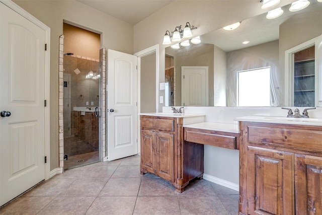 bathroom with vanity, tile patterned floors, and a shower with door