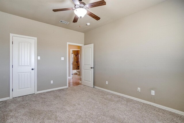 unfurnished bedroom featuring ceiling fan and light colored carpet